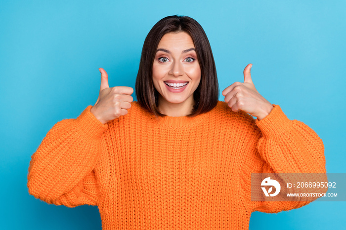 Portrait of attractive funny cheerful girl showing double thumbup trust perfect yes isolated over bright blue color background