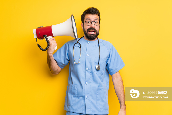 Surgeon doctor man taking a megaphone that makes a lot of noise