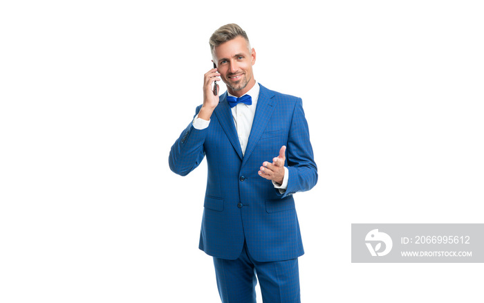 happy man in blue bow tie suit talk on phone isolated on white