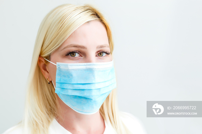 woman with a medical mask for protection again influenza. Shallow depth of field. Copy space for your text.