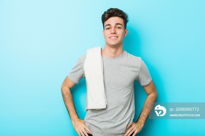 Young fitness teenager man confident keeping hands on hips.