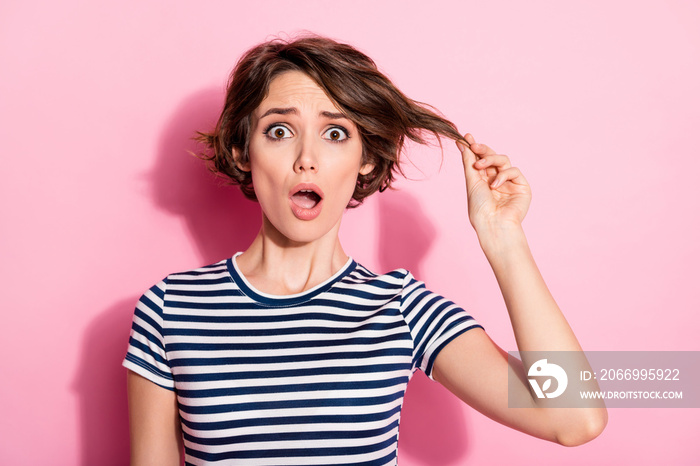 Closeup photo of attractive scared lady hold hand short hairdo curl worried open mouth oh no wear casual white blue t-shirt isolated pastel pink color background