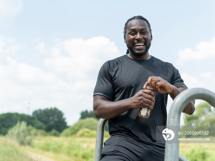 Man drinking protein drink during workout