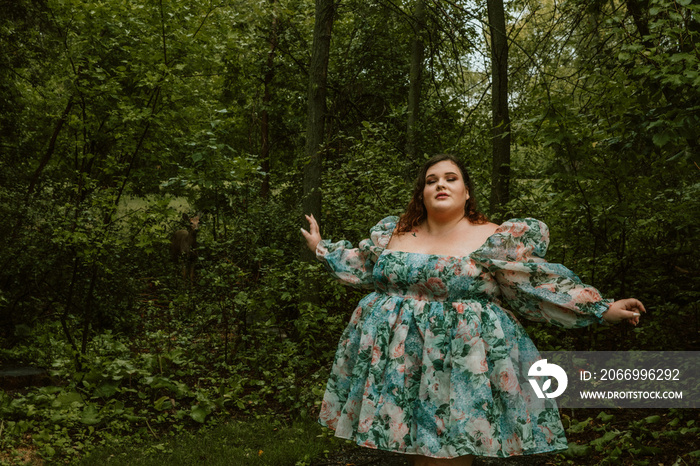 portrait of a plus size woman wearing a floral dress outdoors