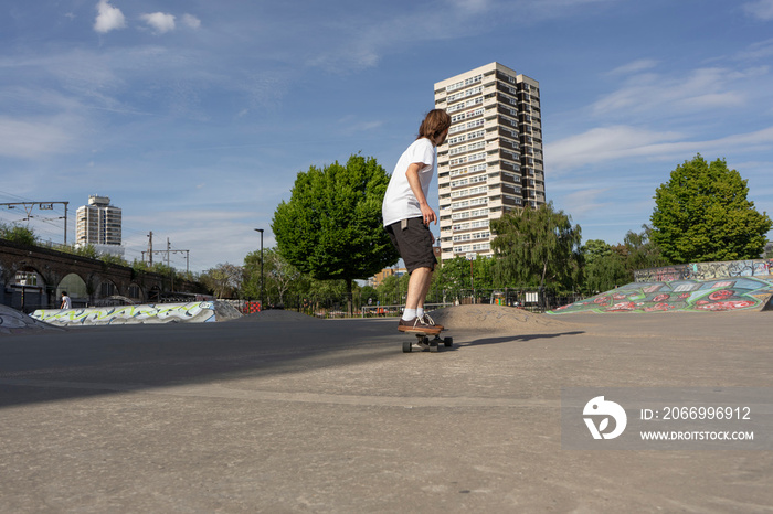 Young man skateboarding in skate park