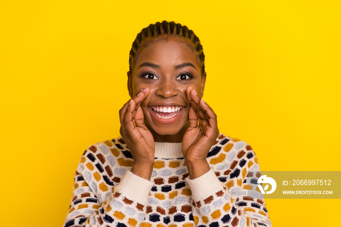 Portrait of cheerful pretty girl hands near mouth say tell information isolated on yellow color background