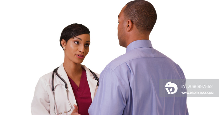 A black doctor advises an African American patient on a white background. An African American medial expert advises her client on a blank backdrop