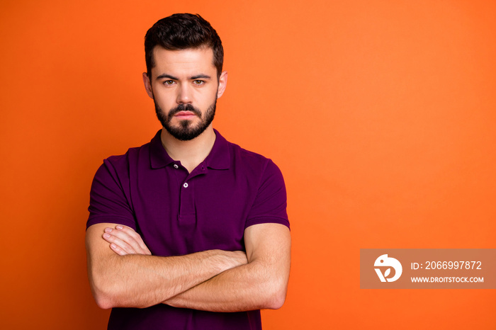 Portrait of serious focused guy start-up worker real expert cross hands can solve problems wear modern clothing isolated over vivid color background