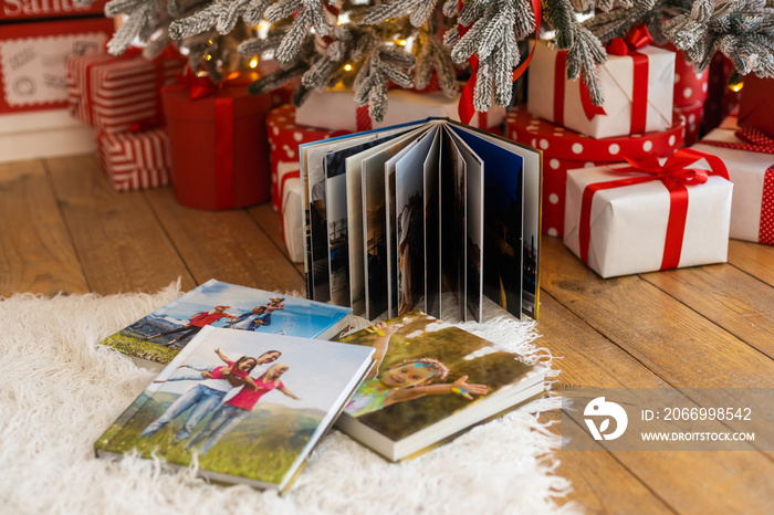 a Photobook of family.Photobook is gift. photo album next to gifts