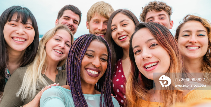 Young friends from diverse cultures and races taking photo making happy faces - Youth, millennial generation and friendship concept with students people having fun together - Focus on close-up girls