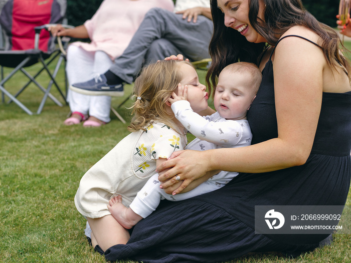 Mother with daughter and baby son