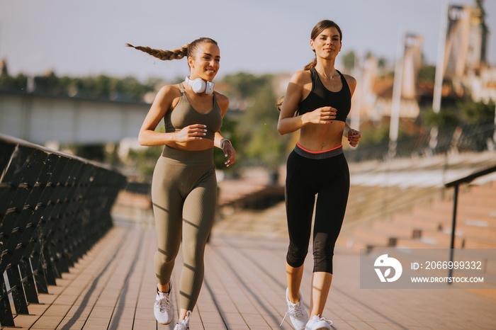 Young woman taking running exercise by the river promenade