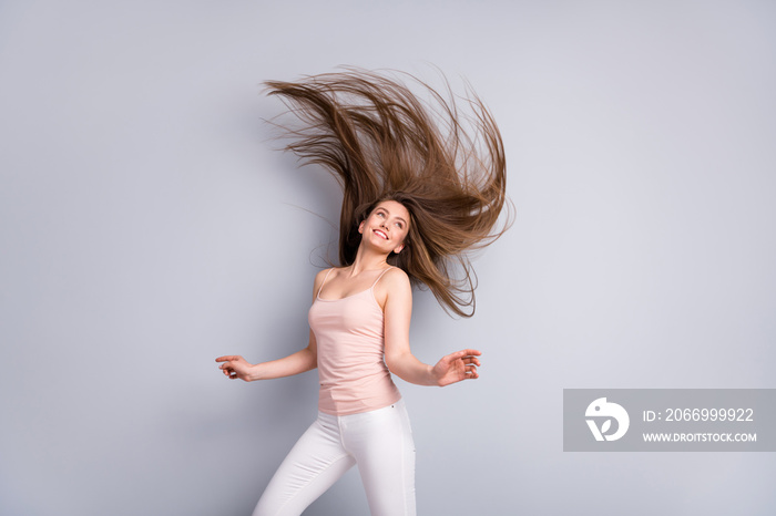 Portrait of her she nice attractive lovely pretty cheerful cheery brown-haired girl throwing shine hair enjoying salon procedure effect isolated on light gray pastel color background