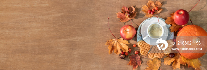 Autumn, fall leaves, a hot steaming cup of coffee, pumpkin and a warm sweater on a wooden table back