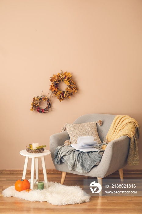 Stylish interior of living room with autumn decor