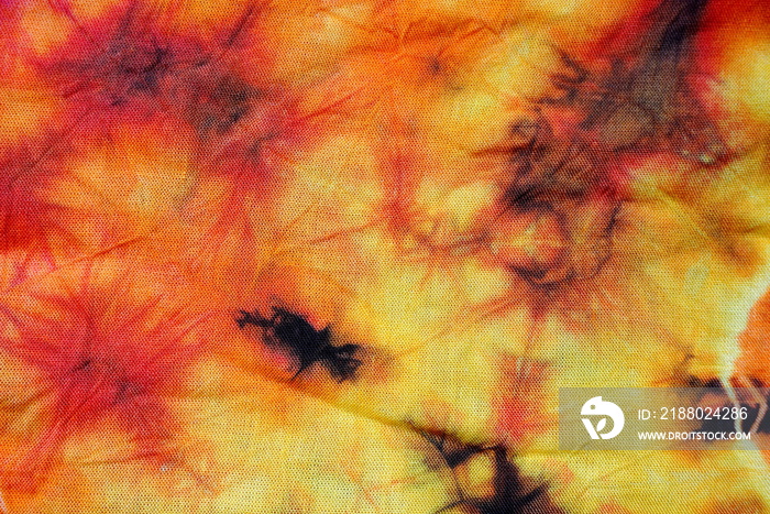colorful orange tie dye fabric pattern texture for background