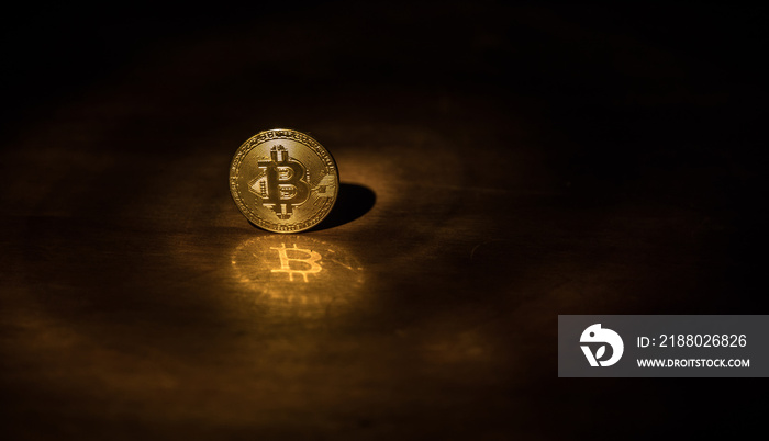 Golden Bitcoin on dark backround. New virtual money. Crypto currency