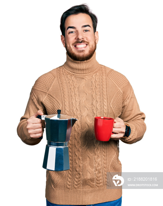 Young hispanic man drinking italian coffee celebrating crazy and amazed for success with open eyes screaming excited.