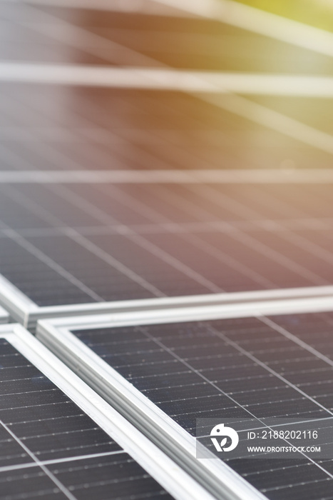 Black solar panels, close-up view. Vertical Industrial background with copy space. Green energy.