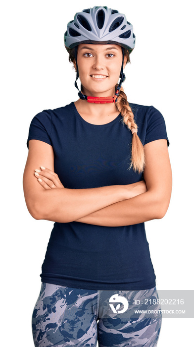 Beautiful caucasian woman wearing bike helmet happy face smiling with crossed arms looking at the camera. positive person.