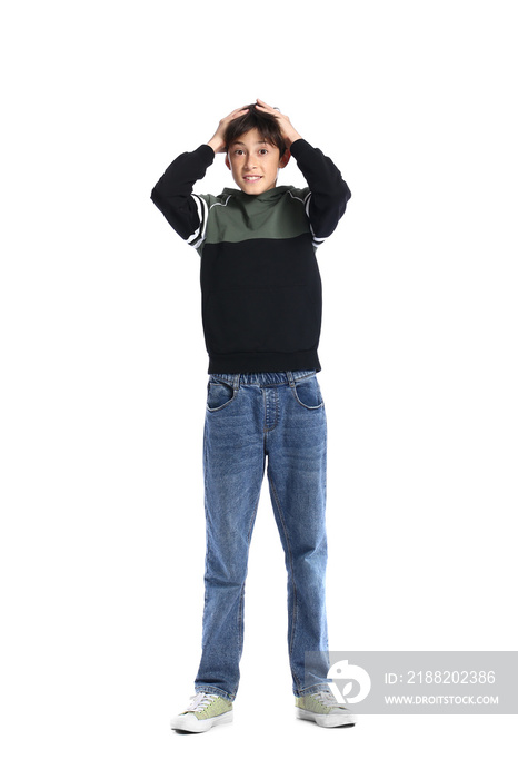 Surprised teenage boy in hoodie on white background