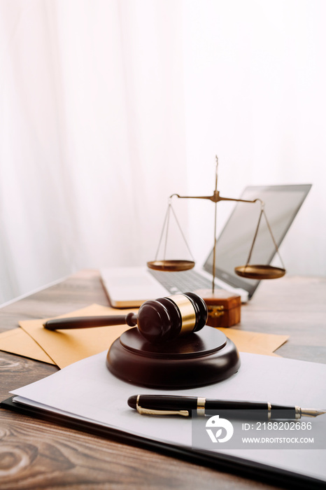 Business and lawyers discussing contract papers with brass scale on desk in office. Law, legal services, advice, justice and law concept picture with film grain effect