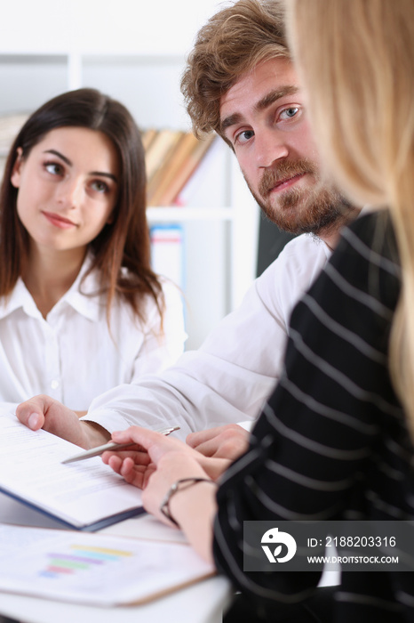 Group of people sit in office deliberate on problem