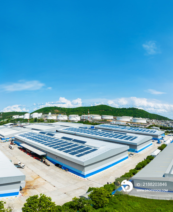 Top view Solar Cell on Warehouse Factory. Solor photo voltaic panels system power or Solar Cell on industrial building roof for producing green ecological electricity. Production of renewable energy.