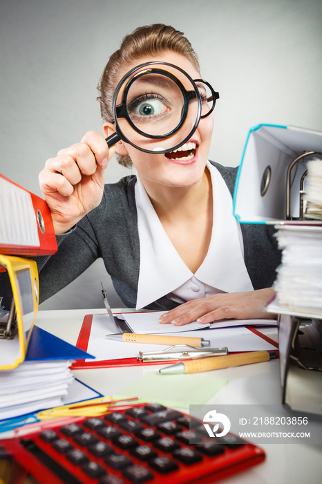 Crazy bizarre businesswoman with big loupe.