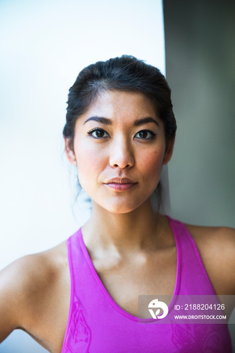 Portrait of young woman in tank top