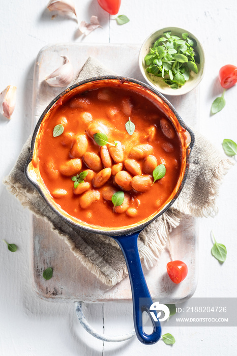 Enjoy your baked beans with garlic and fresh tomatoes