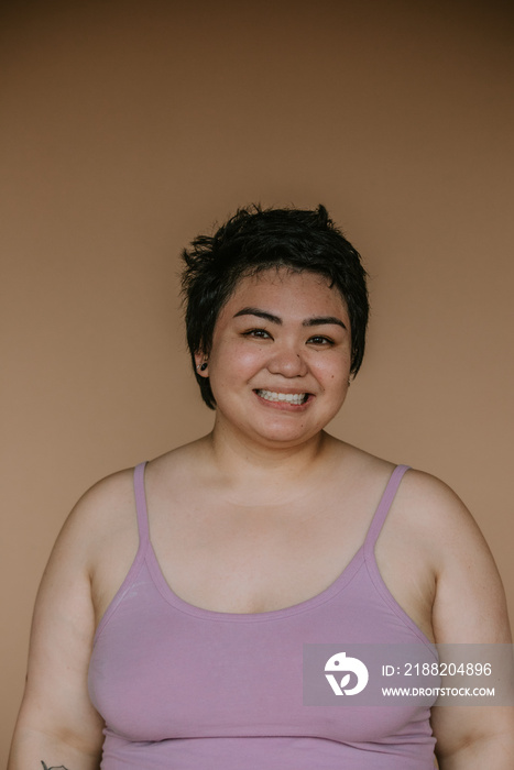 portrait of a plus size filipino woman smiling