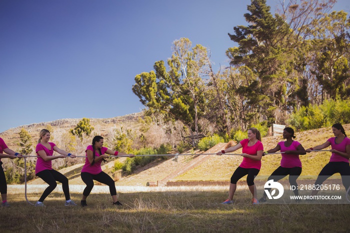 Group of women playing tug of war