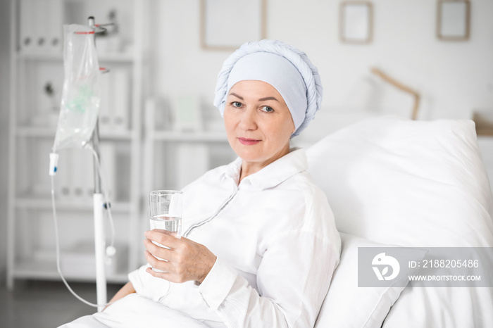 Mature woman undergoing chemical therapy course in clinic