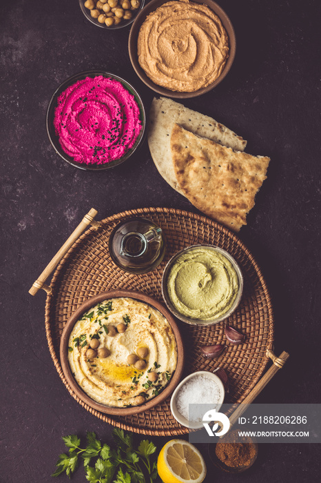 Flat-lay of Various Vegetarian dips hummus