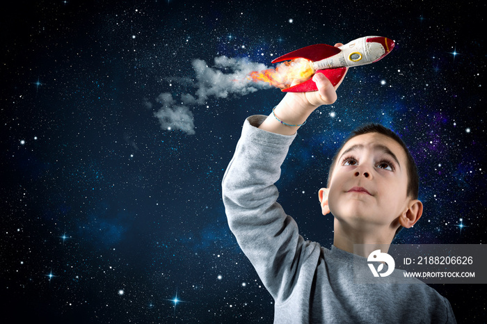 Child plays with a rocket. Concept of imagination