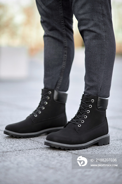 standing man legs in black suede plain boots