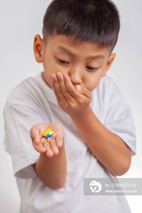 boy does not want to take pills