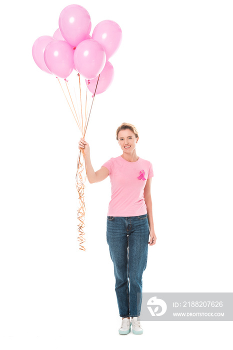 happy woman holding pink balloons and smiling at camera isolated on white, breast cancer concept