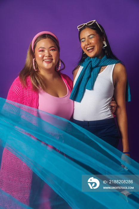 Asian duo fashion colour-blocked studio portrait