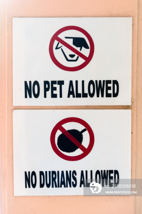 Signs at the entrance to a hotel warning guests that pets and Durian fruit are not permitted, Thailand