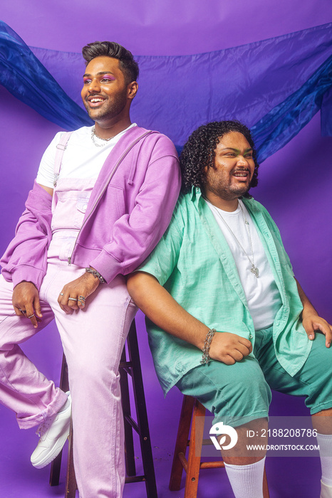 South Asian male duo colour blocked fashion studio portrait