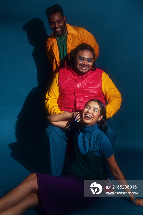 Asian trio colour blocked fashion studio portrait