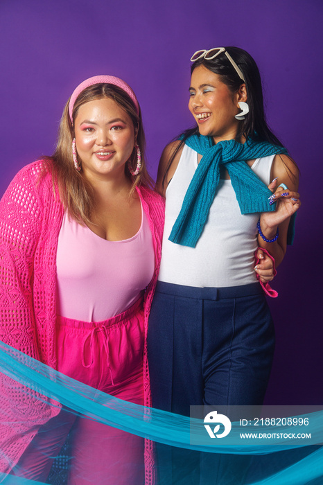 Asian duo colour blocked fashion studio portrait