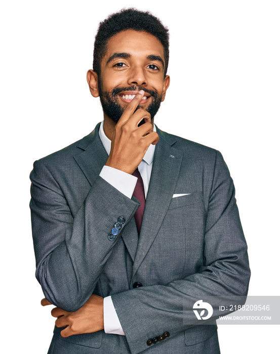 Young african american man wearing business clothes looking confident at the camera with smile with crossed arms and hand raised on chin. thinking positive.