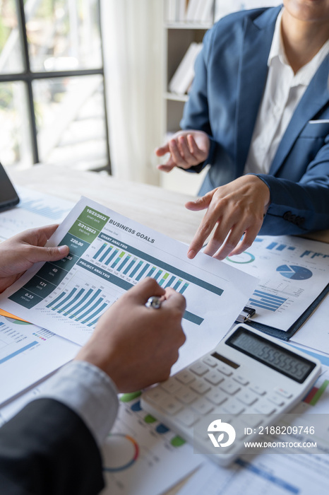 Asian business people brainstorming in a graph analytical computing plan meeting. data chart Marketing growth. Finance. The concept of business success statistics.