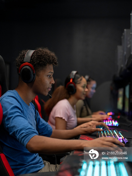 Friends playing video games in gaming club