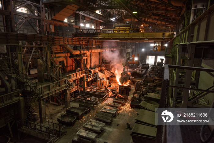 Tank pours liquid metal at the steel mill