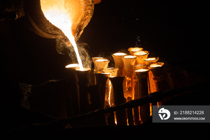 Industrial lost wax casting. The process of pouring for filling out ceramic shells with molten steel.