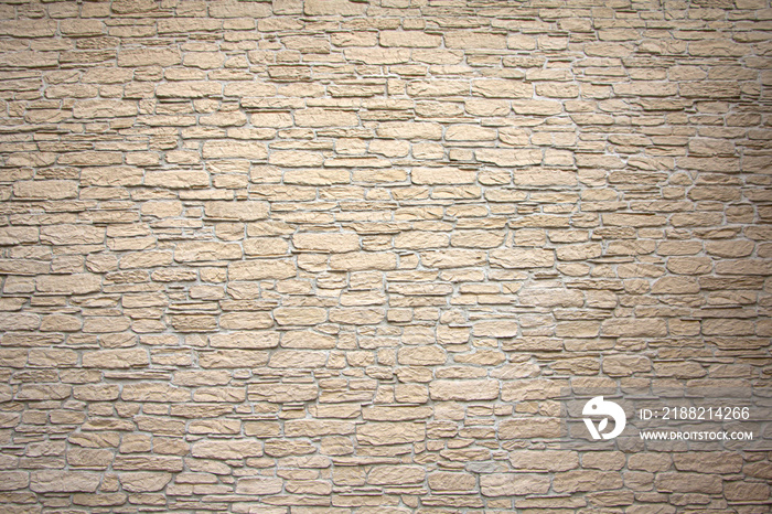 Texture of stone wall, square yellow travertine tile.